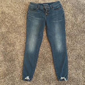 Women’s distressed button fly jeans
